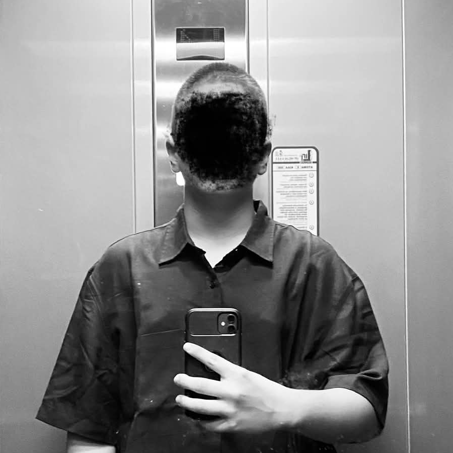 Portrait of Tryfon, known online as VaultFN, CEO of TheAgency Training